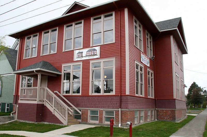 The Acupuncture Health Center building, a red two-story house on Astor Street